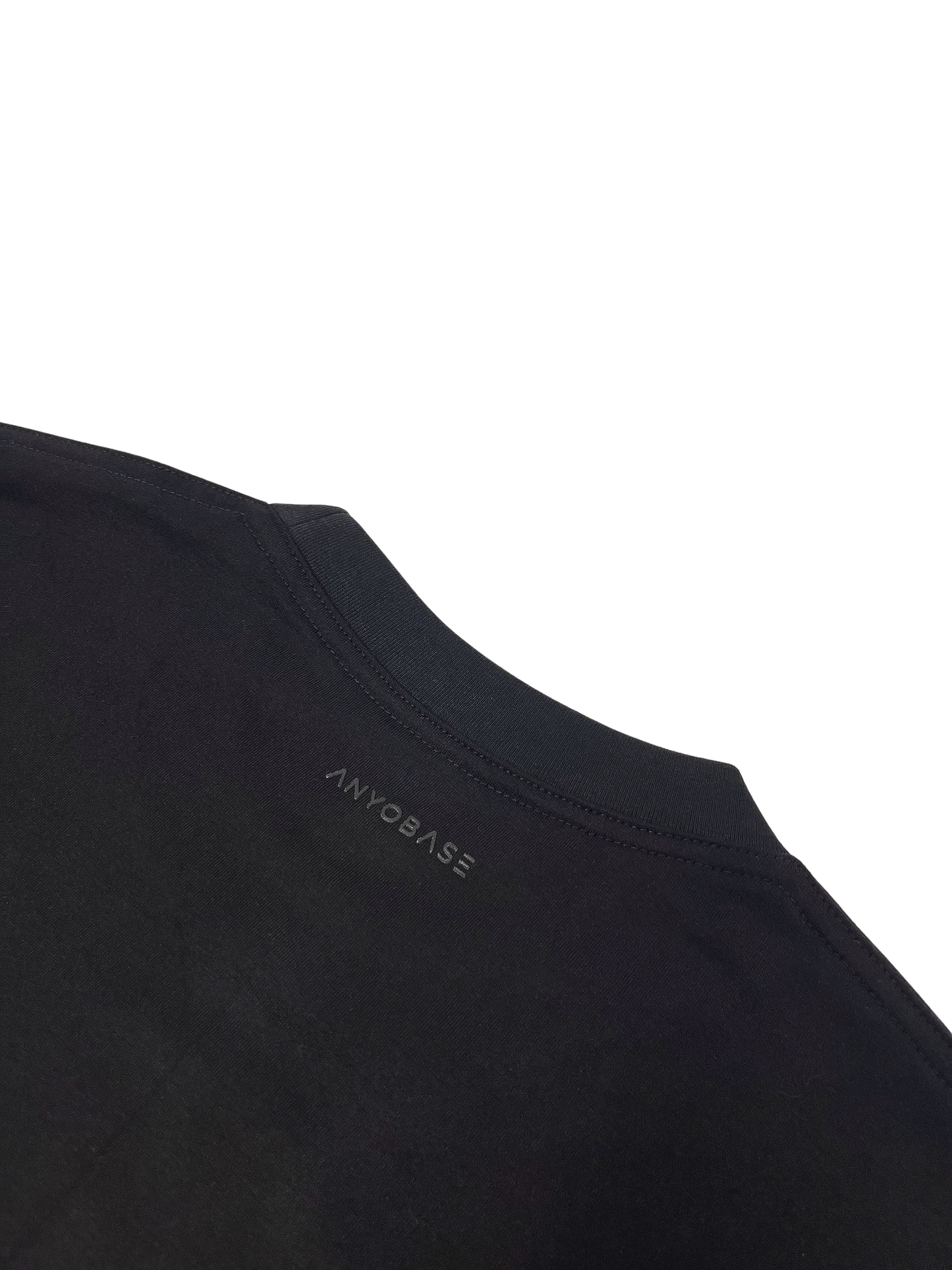 ANYOBASE Core Tee in Black featuring a tonal back-neck logo.